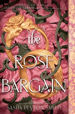 Paperback copy of "The Rose Bargain" by HarperCollins featuring a cover with floral design and title text.
