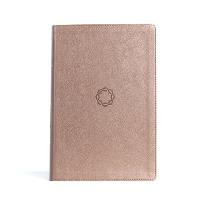 KJV Essential Teen Study Bible by Holman Bibles with rose gold Leathertouch cover and detailed interior pages.