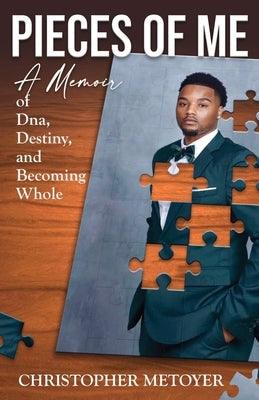 Paperback copy of "Pieces of Me" memoir by Christopher Metoyer, featuring a cover with DNA imagery and personal story themes.