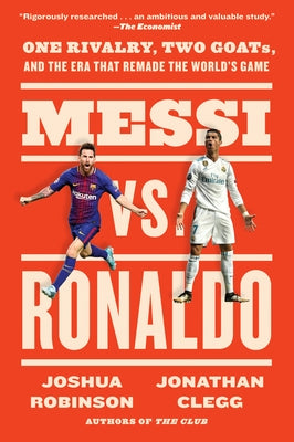 Paperback book titled "Messi vs. Ronaldo: One Rivalry, Two Goats" by Mariner Books, featuring a cover image with portraits of Messi and Ronaldo.