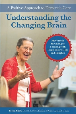 Paperback book titled "Understanding the Changing Brain: A Positive Approach to Dementia Care" by Positive Approach, LLC, with colorful cover art.