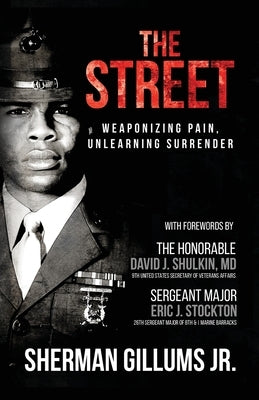 Paperback copy of "The Street: Weaponizing Pain, Unlearning Surrender" by Palmetto Publishing, showing the book cover with title and author.