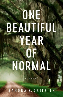 Paperback of "One Beautiful Year of Normal" by She Writes Press, showing the book cover with colorful artwork.