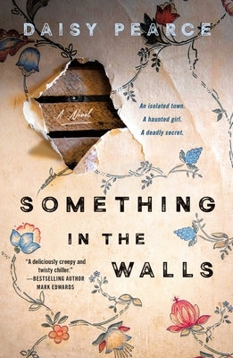 Paperback copy of "Something in the Walls" by Minotaur Books, showing the cover with dark and eerie artwork.