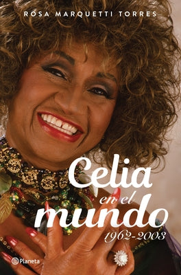 Paperback book titled "Celia En El Mundo 1962-2003" by Planeta Publishing, showing the cover with colorful artwork.