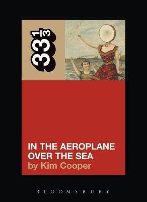 Paperback copy of Neutral Milk Hotel's album "In the Aeroplane Over the Sea" published by Continuum, featuring the album cover art.