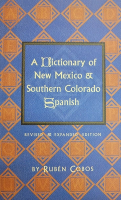 Paperback book titled "A Dictionary of New Mexico and Southern Colorado Spanish" by Museum of New Mexico Press, open to pages.