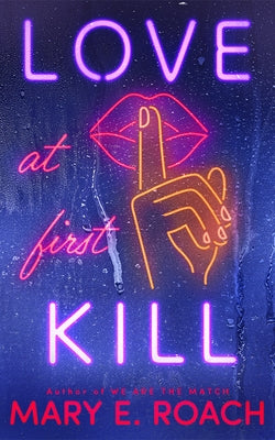 Paperback of Love at First Kill by Montlake, featuring the book cover with dark and romantic imagery.