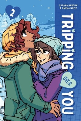 Paperback graphic novel titled "Tripping Over You Book 2" by First Second, featuring colorful cover art with characters and artistic design.