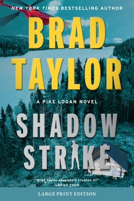 Paperback edition of Shadow Strike: A Pike Logan Novel by William Morrow Large Print, featuring a cover with suspenseful artwork.