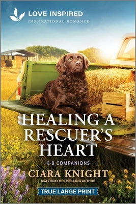 Paperback of "Healing a Rescuer's Heart" inspirational romance from Love Inspired True Large Print, showing the book cover with warm tones.