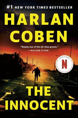 Paperback copy of The Innocent suspense thriller by Penguin Publishing Group, featuring a dark cover with mysterious imagery.