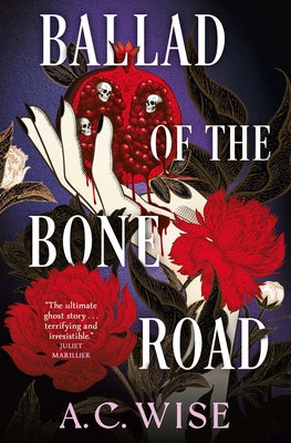 Paperback copy of "Ballad of the Bone Road" by Titan Books UK, showing the book cover with title and artwork.