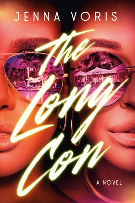 Paperback copy of "The Long Con" by Dial Press, featuring the book cover with title and author details.