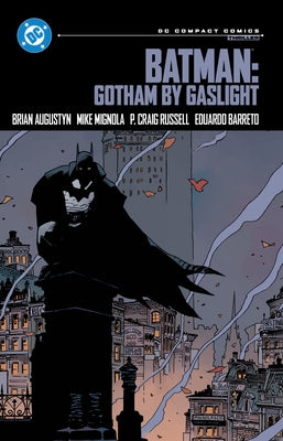 Paperback DC Comics Batman: Gotham by Gaslight comic book, featuring Batman in a dark, gothic Gotham City setting.