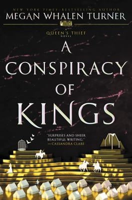 Paperback copy of "A Conspiracy of Kings" by Greenwillow Books, featuring the book cover with title and artwork.