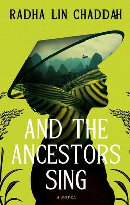 Paperback copy of "And the Ancestors Sing" by Rising Action, featuring the book cover with artistic design.