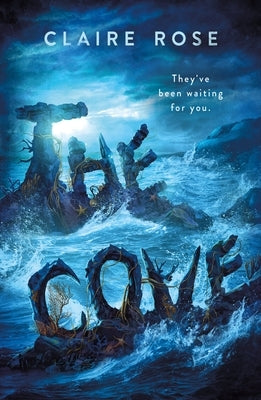 Paperback copy of "The Cove" by Wednesday Books, featuring the book cover with ocean-themed artwork.