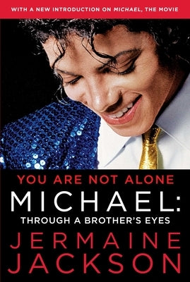 Paperback of "You Are Not Alone: Michael: Through a Brother's Eyes" by Avid Reader Press, showing the book cover with text and imagery.
