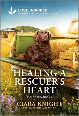 Mass market paperbound of "Healing a Rescuer's Heart" inspirational romance novel by Love Inspired, showing the book cover.