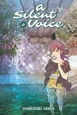 Paperback copy of A Silent Voice 6 by Kodansha Comics, featuring the book's cover with artwork and title.