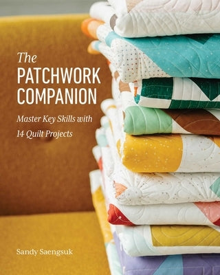 Paperback book titled The Patchwork Companion by Stash Books, showcasing colorful quilt project covers on the front.