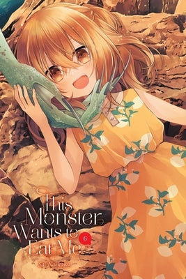 Paperback of "This Monster Wants to Eat Me, Vol. 6" manga by Yen Press featuring colorful cover art with monster characters.