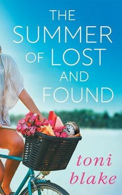 Paperback of The Summer of Lost and Found by Montlake, featuring a colorful cover with a scenic summer landscape.