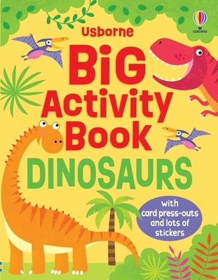Open paperback activity book titled "Big Activity Book Dinosaurs" by Usborne Books featuring colorful dinosaur illustrations and puzzles.