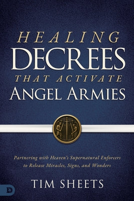 Paperback book titled "Healing Decrees that Activate Angel Armies" by Destiny Image, featuring spiritual imagery on the cover.