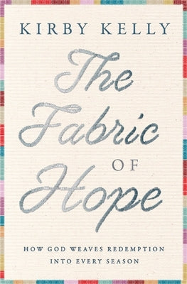Paperback book titled "The Fabric of Hope" by Thomas Nelson, featuring a cover with woven fabric in warm tones.
