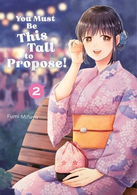 Paperback of "You Must Be This Tall to Propose! 2" by Kodansha Comics, featuring colorful cover art with characters and playful design.