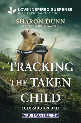 Paperback book titled "Tracking the Taken Child" by Love Inspired Suspense True Large Print, with a cover featuring a mysterious scene.