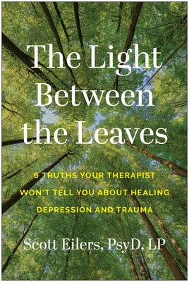 Paperback book titled "The Light Between the Leaves" by Benbella Books, focusing on healing depression and trauma.