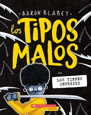 Paperback of Los Tipos Malos En Los Tienes Detrázzz by Scholastic en Espanol, showing colorful cover with cartoon characters.