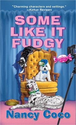Cover of the mass market paperback book "Some Like It Fudgy" by Kensington Cozies featuring a colorful, illustrated dessert-themed design.