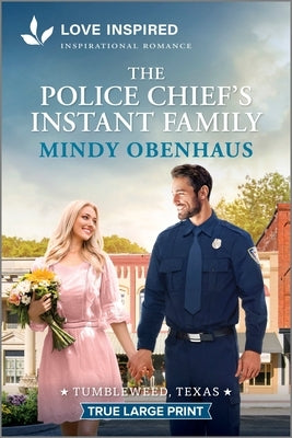 Paperback copy of The Police Chief's Instant Family by Love Inspired True Large Print, featuring a romantic and uplifting cover design.