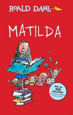 Paperback of Matilda Spanish edition by Alfaguara Infantil, showing the book cover with colorful illustrations.