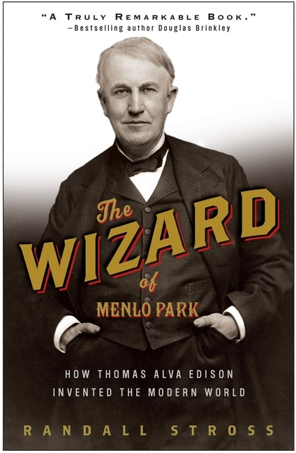 Paperback book titled "The Wizard of Menlo Park" by Crown Publishing Group, featuring a cover with Edison and invention imagery.