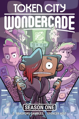Paperback of Token City Wondercade comic book by Top Shelf Productions, featuring colorful cover art and intriguing illustrations.