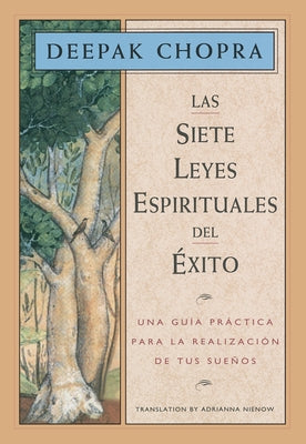 Paperback of The Seven Spiritual Laws of Success by Janet L. Mills, featuring the book cover with title and author details.