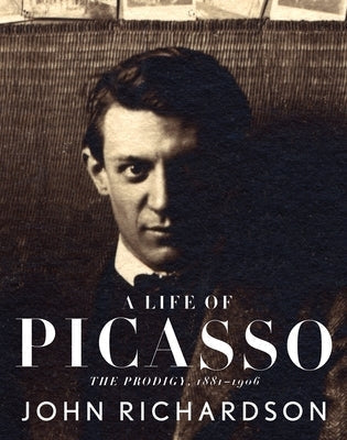 Paperback book titled "A Life of Picasso I: The Prodigy 1881-1906" published by Knopf Publishing Group, with cover featuring Picasso's artwork.