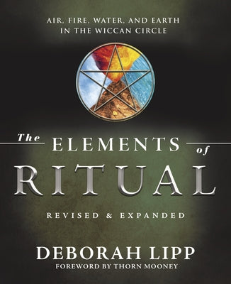 Paperback copy of The Elements of Ritual by Llewellyn Publications, featuring air, fire, water, and earth symbols on the cover.
