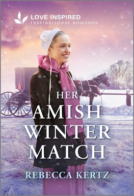 Mass market paperbound book cover of "Her Amish Winter Match" by Love Inspired featuring a romantic winter scene.