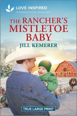 Paperback of The Rancher's Mistletoe Baby by Love Inspired True Large Print, featuring a warm, festive cover design.