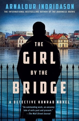 Paperback of The Girl by the Bridge: A Detective Konrad Novel by Minotaur Books, featuring the book cover with title and author details.