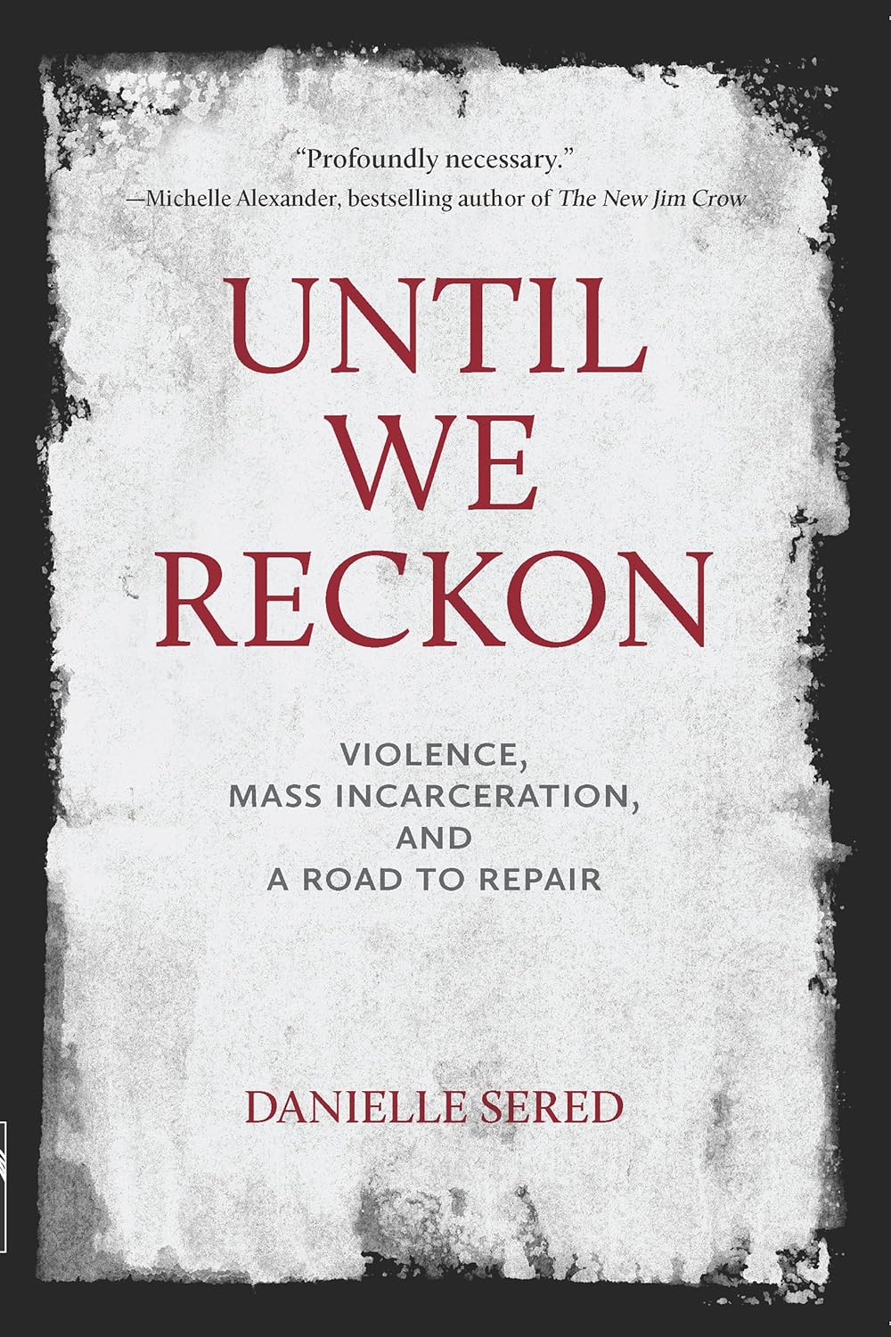 Paperback book "Until We Reckon" by New Press, featuring a cover design focused on themes of violence and repair.