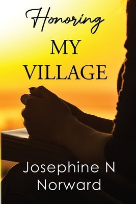 Paperback of "Honoring My Village" by Olympia Publishers, showing the book cover with title and author details.