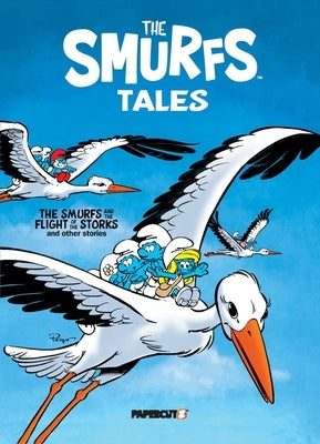 Paperback of The Smurfs Tales Vol. 14 by Papercutz, featuring colorful Smurfs characters on the cover.