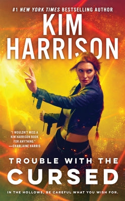 Paperback of "Trouble with the Cursed" by Penguin Publishing Group, showing the book cover with title and author details.